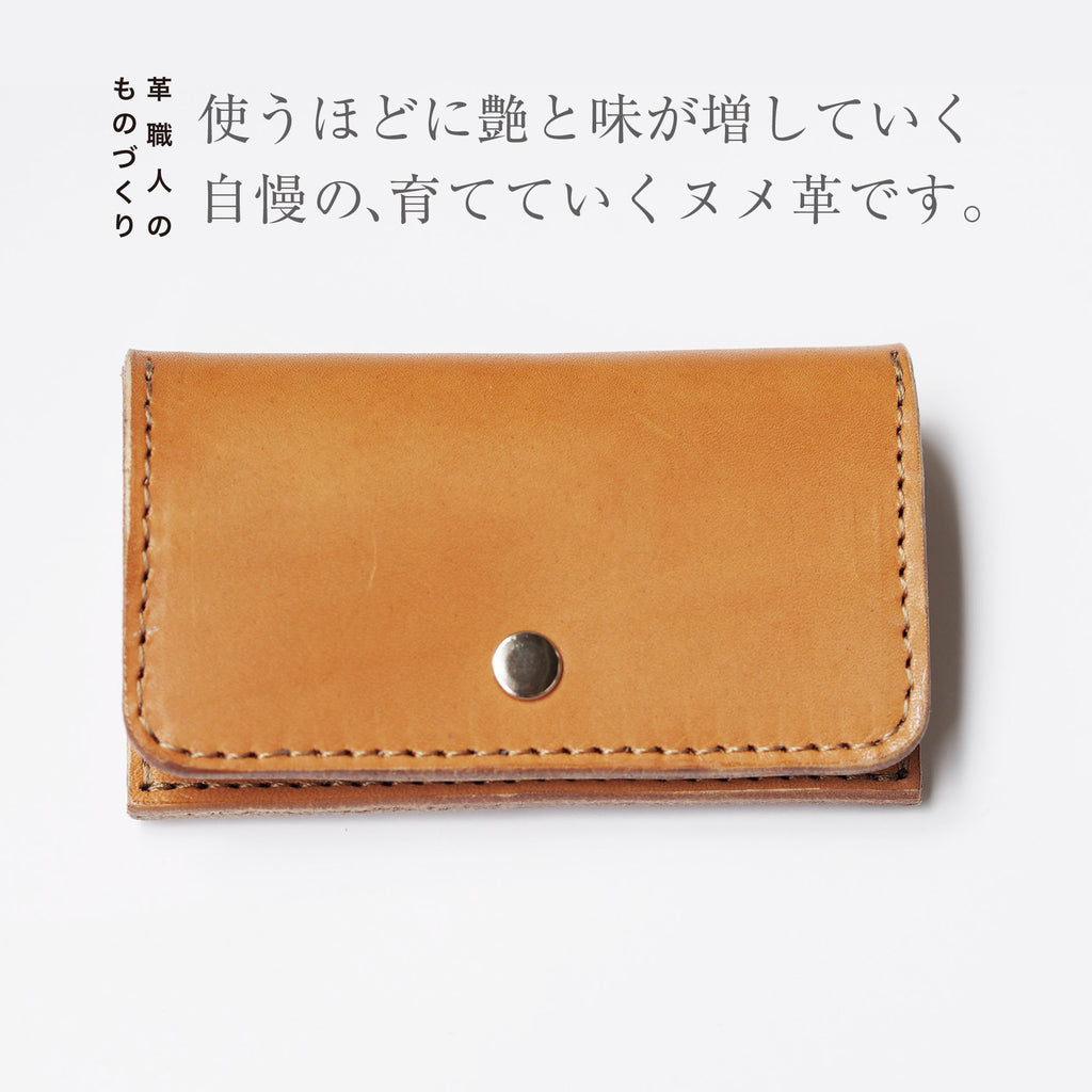 Box-shaped coin case that opens wide for easy access